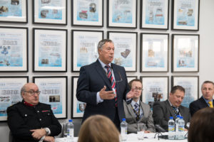Roy Burton, managing director, giving a speech to visitors