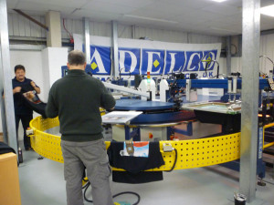 Loading the T shirts onto the first platen