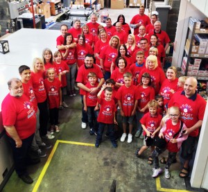 Staff and their family members wear their personalised T shirts